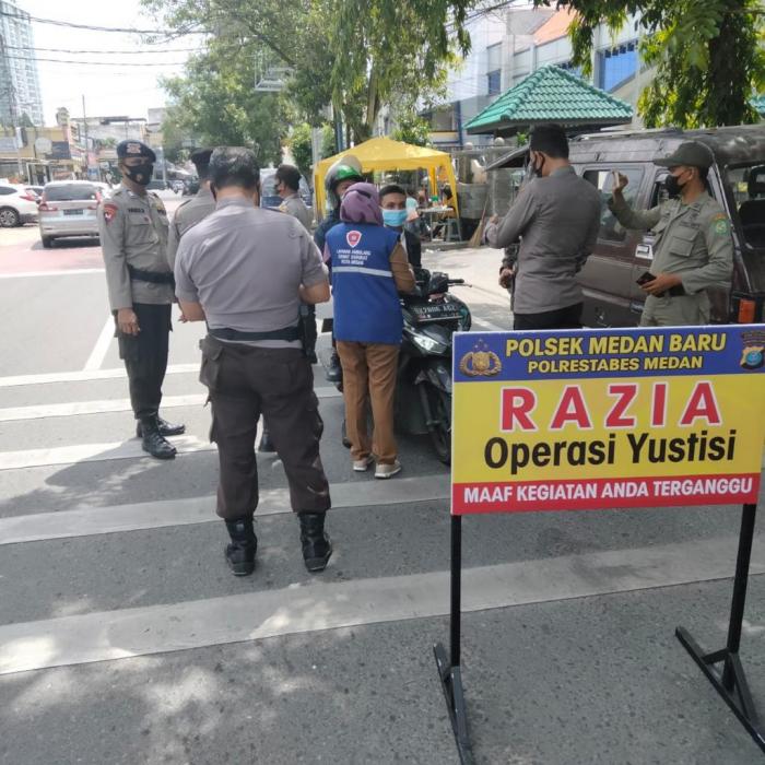 Melalui Ops Yustisi, Brimob Polda Sumut Sampaikan Imbauan Prokes Kepada Masyarakat