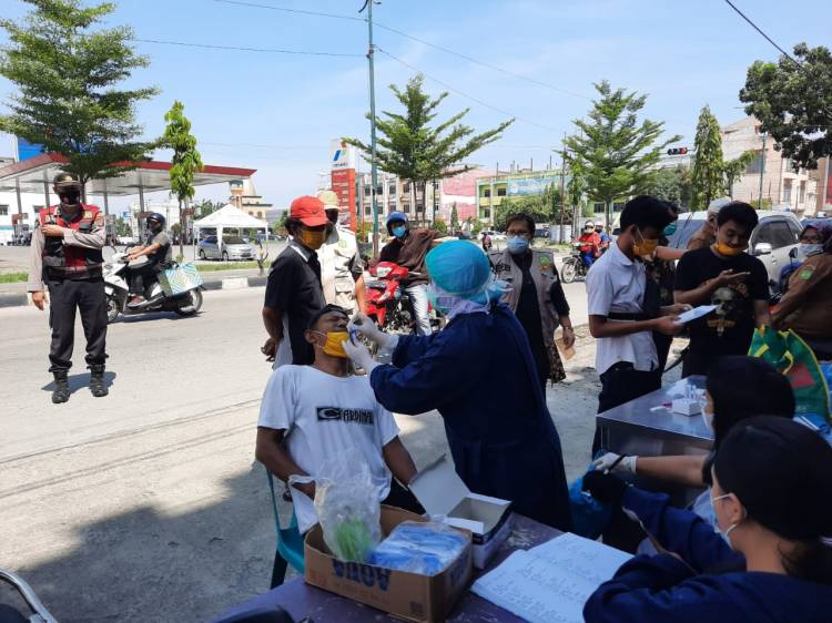 Tekan Penyebaran Covid-19, Brimob Polda Sumut Laksanakan Yustisi Razia Masker